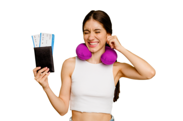 Young caucasian woman with inflatable travel pillow holding a passport isolated covering ears with hands.