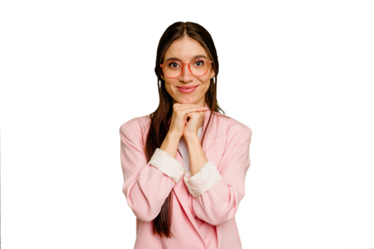 Young caucasian long hair woman isolated keeps hands under chin, is looking happily aside.