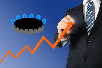 Gas prices increasing. Businessman points at a graph of energy or gas prices going up. Gas stove symbol.