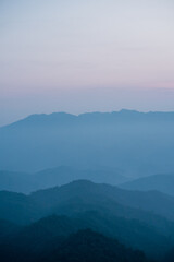Fototapeta na wymiar wide view layer of mountain with sunrise background