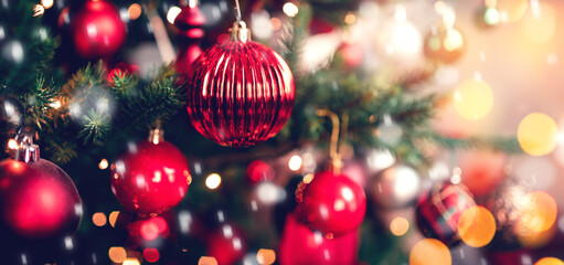Banner dark red decorated christmas tree pine on blurred background bokeh sun light
