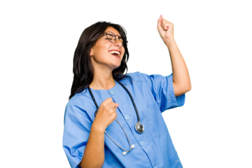 Young nurse Indian woman isolated raising fist after a victory, winner concept.