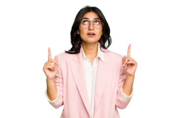 Young Indian business woman wearing a pink suit isolated pointing upside with opened mouth.