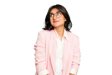Young Indian business woman wearing a pink suit isolated dreaming of achieving goals and purposes