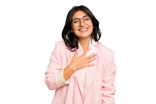 Young Indian business woman wearing a pink suit isolated laughs out loudly keeping hand on chest. - Powered by Adobe