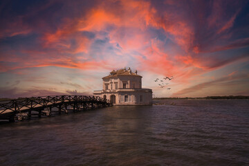 Casina Vanvitelliana at sunset, is a house located on an island of Lake Fusaro, in Bacoli. It is one of the most important attractions of Campania in southern Italy, near Naples, Italy