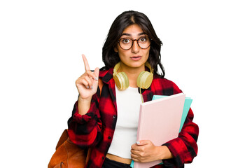 Young student Indian woman wearing headphones isolated having some great idea, concept of creativity.