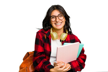 Young student Indian woman wearing headphones isolated laughing and having fun. - obrazy, fototapety, plakaty