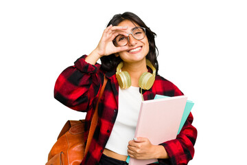 Young student Indian woman wearing headphones isolated excited keeping ok gesture on eye.