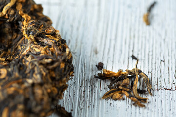 pressed tea layer on  wooden old board. top view