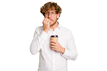 Business caucasian man holding a coffee to take away isolated on white background biting fingernails, nervous and very anxious.