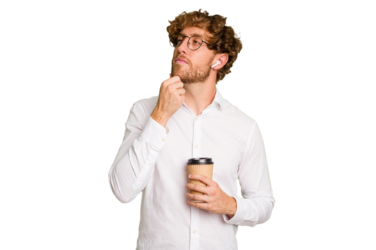 Business caucasian man holding a coffee to take away isolated on white background looking sideways with doubtful and skeptical expression.