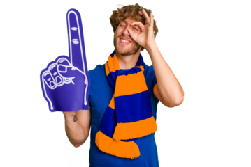 Young caucasian sports fan man isolated on white background excited keeping ok gesture on eye.