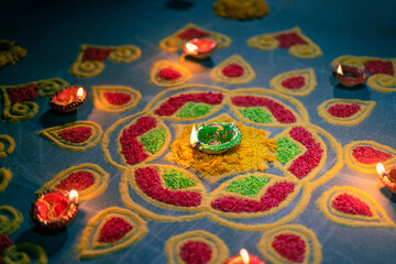 Fototapeta na wymiar Happy Diwali - Diya lamps lit during diwali celebration