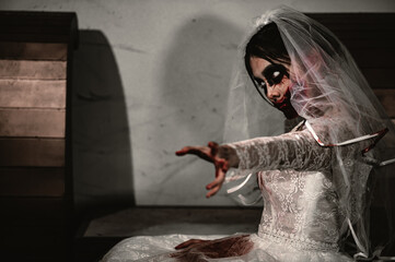 Halloween festival concept,Asian woman makeup ghost face,Bride zombie charactor,Horror movie wallpaper or poster