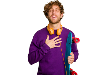 Young skater caucasian man isolated on white background laughs out loudly keeping hand on chest.