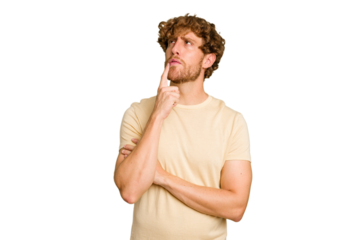 Young caucasian man isolated on green chroma background looking sideways with doubtful and skeptical expression.