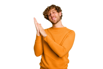 Young caucasian man isolated on green chroma background feeling energetic and comfortable, rubbing hands confident.