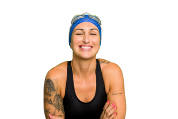 Young caucasian swimmer woman isolated on green chroma background laughing and having fun.