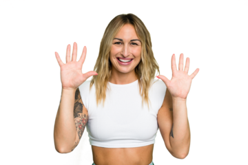 Young caucasian woman isolated on green chroma background showing number ten with hands.