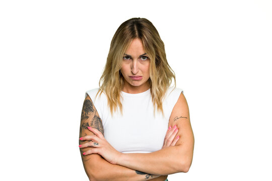 Young caucasian woman isolated on green chroma background unhappy looking in camera with sarcastic expression.