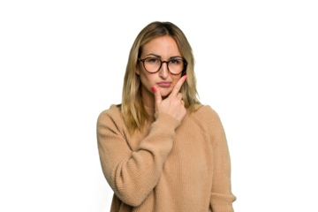 Young caucasian woman isolated on green chroma background contemplating, planning a strategy, thinking about the way of a business.