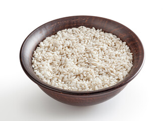 Uncooked arborio rice in ceramic bowl isolated on white background with clipping path