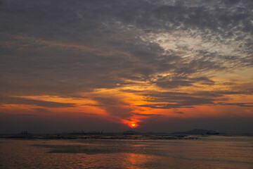 Naklejka na ściany i meble Sunset sky at sea with Si Chang island silhouette background