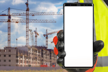 Construction apps. Mobile phone in builders hand. Apps for assistance builders concept. Smart phone...