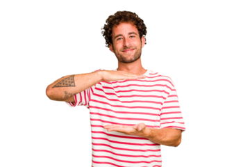 Young caucasian curly hair man isolated Young caucasian man with curly hair isolated holding something with both hands, product presentation.