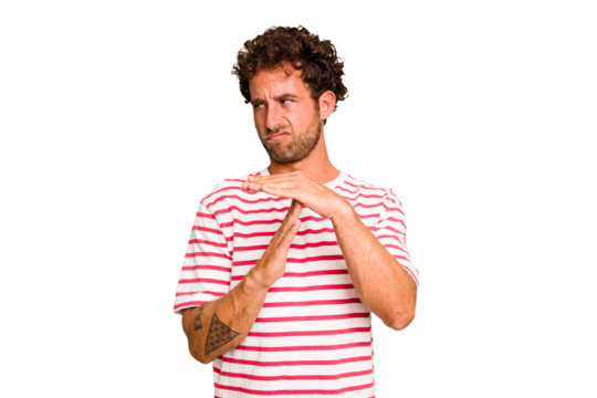 Young caucasian curly hair man isolated Young caucasian man with curly hair isolated showing a timeout gesture.