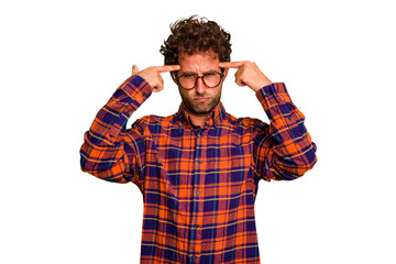 Young caucasian curly hair man isolated Young caucasian man with curly hair isolated focused on a task, keeping forefingers pointing head.