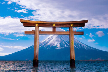 Buddhist wooden arch. Traditional Buddhist gate in water. Wooden ancient arch is located in lake....