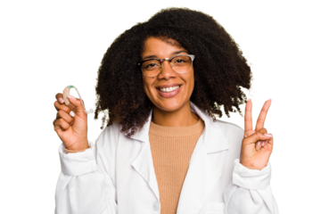 Young otorhinolaryngologist African american woman holding hearing aid isolated showing number two with fingers.