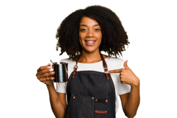 Young African American woman barista isolated person pointing by hand to a shirt copy space, proud and confident