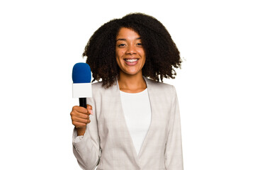 Young TV presenter African American woman with a microphone isolated happy, smiling and cheerful.