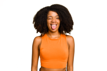Young African American woman isolated funny and friendly sticking out tongue.