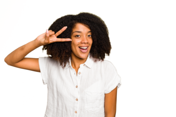 Young African American woman isolated dancing and having fun.