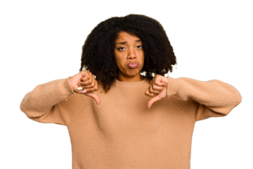 Young African American woman isolated showing a dislike gesture, thumbs down. Disagreement concept.