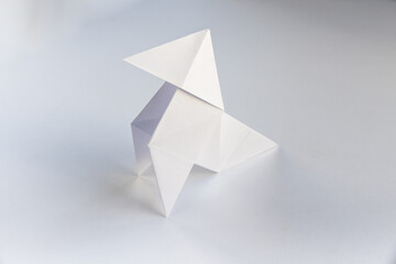 Paper hen origami isolated on a white background