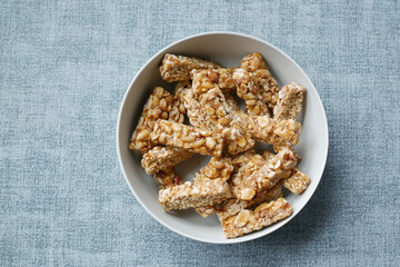 peanuts sweet candy in a bowl on table 