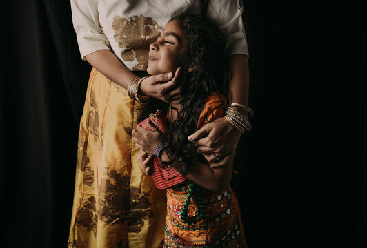 A portrait of a Mother giving hugs to her daughter 