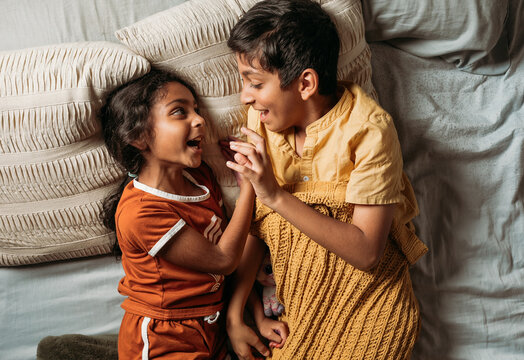 Brother and sister holding hands 