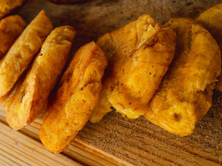 Mashed and fried green plantain, called toston, patacon, mariquita, in Latin America