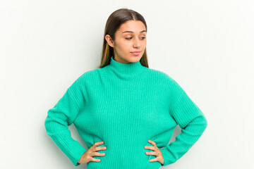 Young Indian woman isolated on white background dreaming of achieving goals and purposes