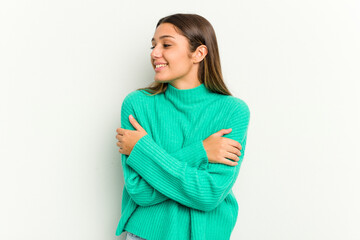 Young Indian woman isolated on white background laughing and having fun.