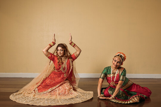 Portrait of two Indian dancers dancing 