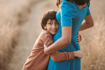 Fototapeta premium A brother hugging his sister