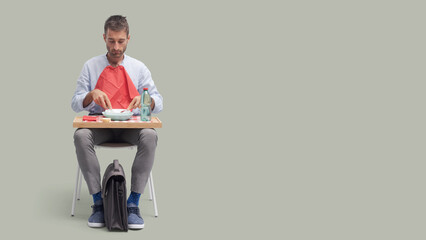 Man sitting on a chair and having lunch break
