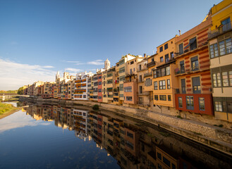 Fototapeta premium girona catalonia spain medieval city old town cathedral Panoramic view of the city with reflection in the Oñar river